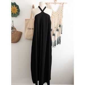 Asos DESIGN Cross Neck Textured Swing Bib Jumpsuit in Black